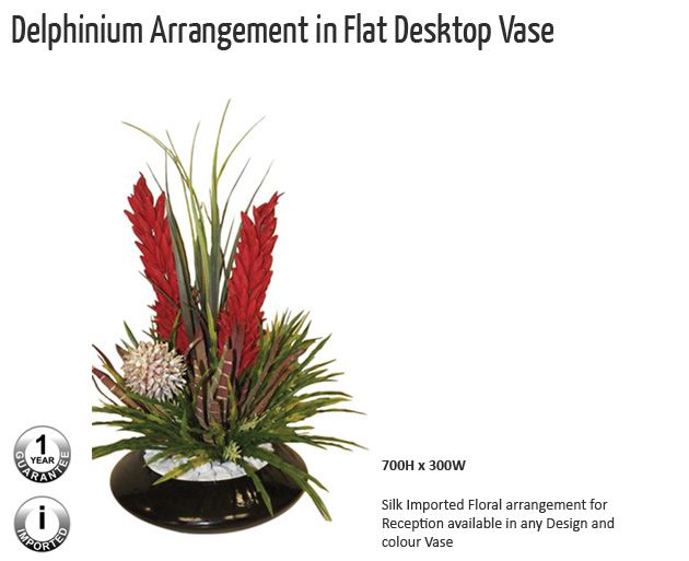 delphinium arrangement in flat destop vase